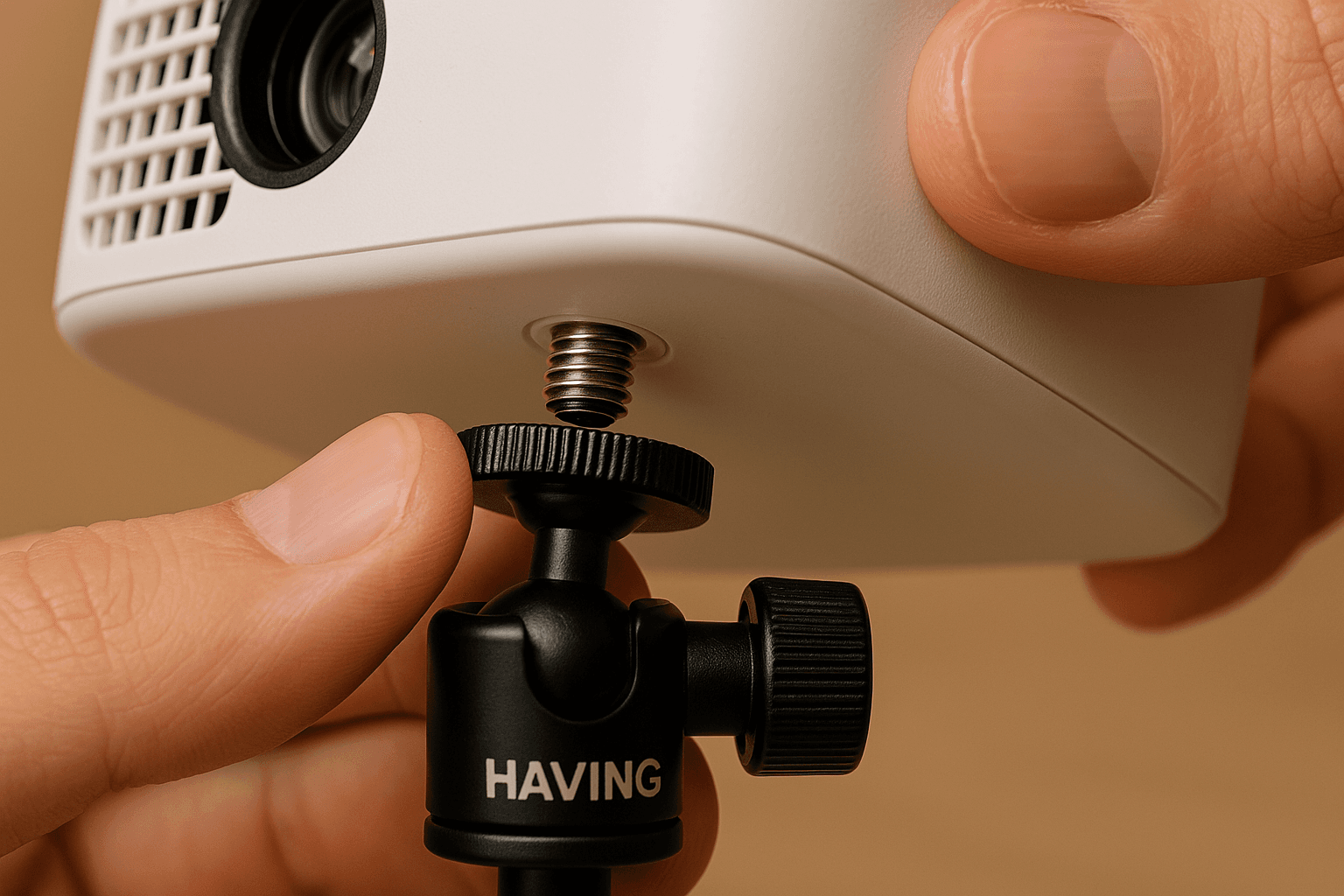 Close up of a 1/4 inch screw mount on a mini projector being attached to a Hvaying floor stand.